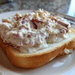 Close-up of creamy chipped beef on toast, featuring a thick white sauce with visible pieces of chipped beef.