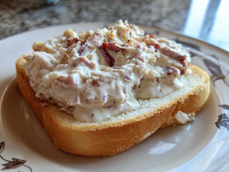Close-up of creamy chipped beef on toast, featuring a thick white sauce with visible pieces of chipped beef.