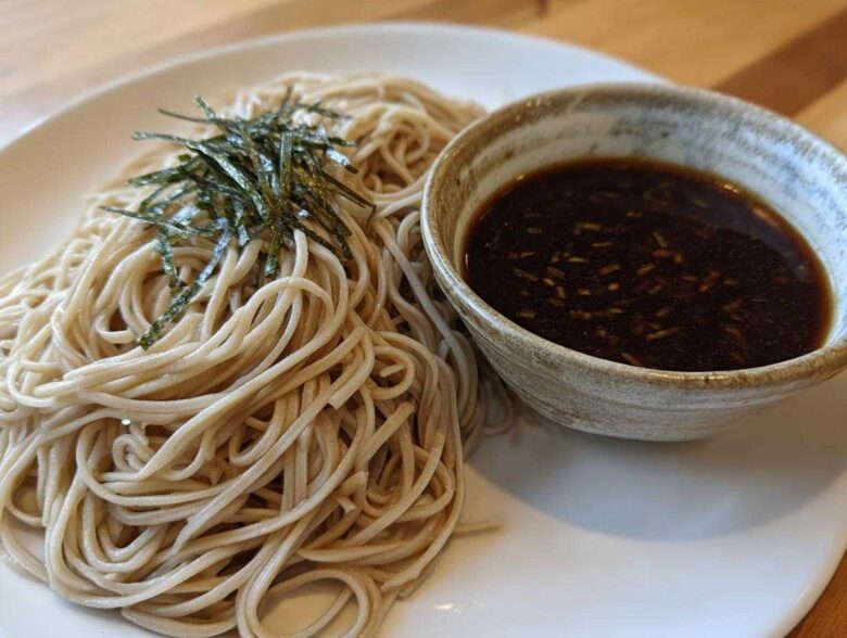 A serving of Cold Soba with Dipping Sauce, featuring chilled buckwheat noodles topped with shredded nori.